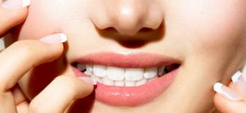 Причины потемнения зубов